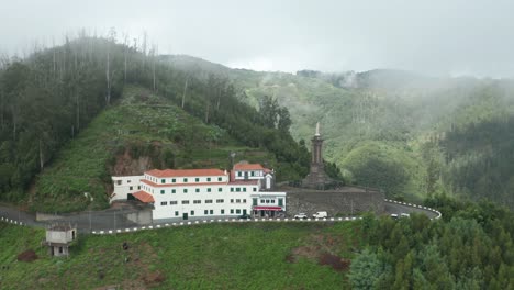 Sanctuary-of-Our-Lady-of-Peace-shrouded-in-mist-in-mountains-of-Madeira,-aerial