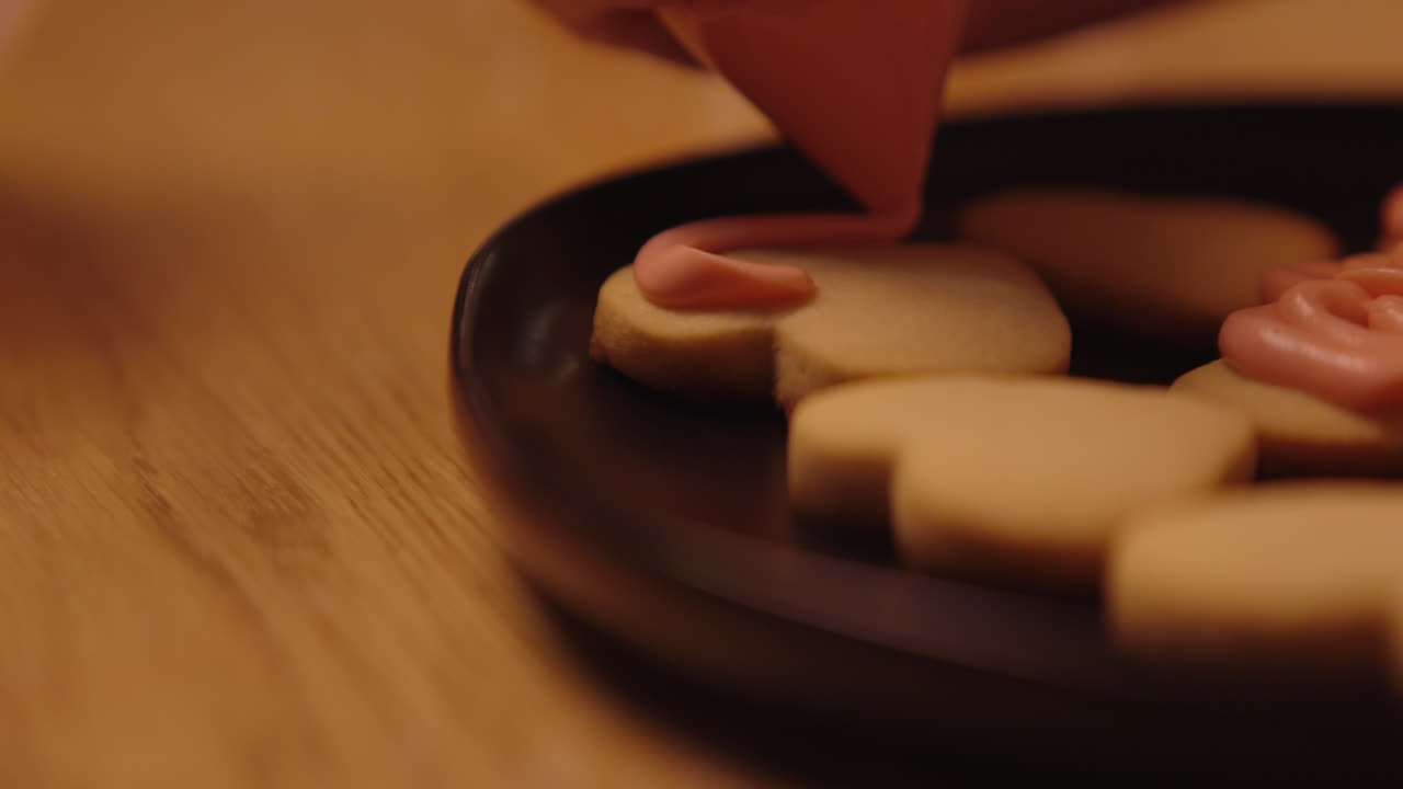Decorating Cookies with Pink Icing