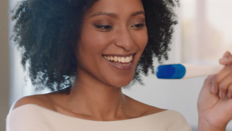 portrait beautiful woman looking at pregnancy test enjoying surprise result showing positive excited for motherhood