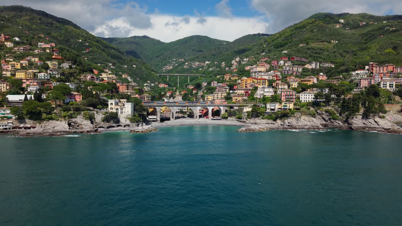 Italian coastal town with colorful houses overlooking the mediterranean sea, aerial view