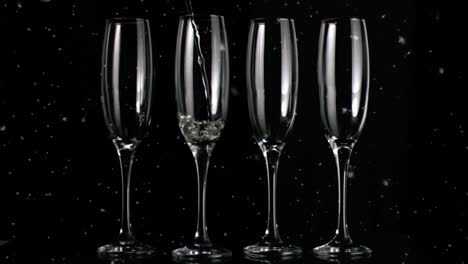 animation of white specks floating over glasses of champagne on black background