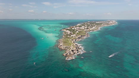 Far-Away-Helicopter-view-of-Isla-Mujeres,-Mexico