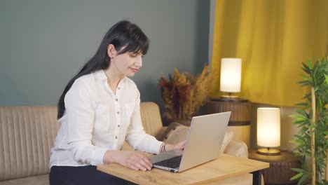 Unhappy woman using laptop laptop at night. It&#039;s not in a good mood.