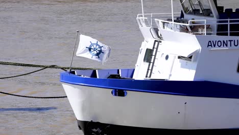 boat with flag on london river