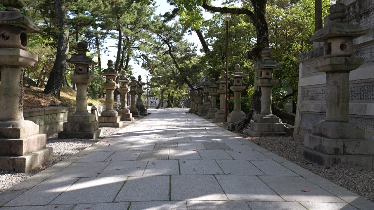 An immersive journey through the historic Shinto sanctuary of Sumiyoshi Taisha in Osaka, Japan, East Asia, showcasing the iconic stone lanterns and peaceful shrine architecture