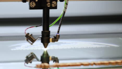 cnc laser engraving on metal and wood, modern industrial technology.