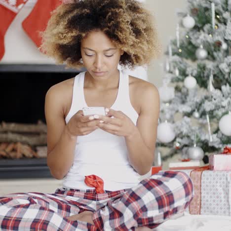 young woman sending a christmas message