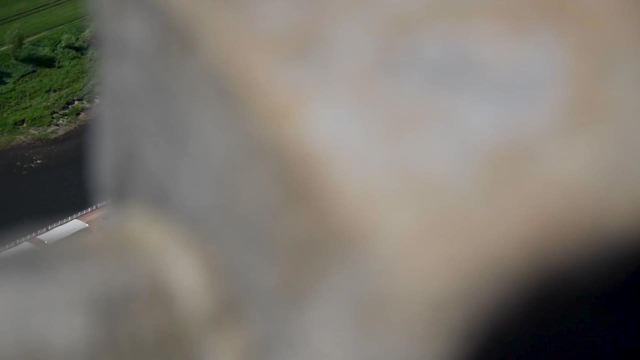 Boat on river from bridge above close up