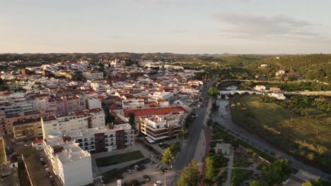 aerial orbit shot over silves town and arade river in the algarve, portugal