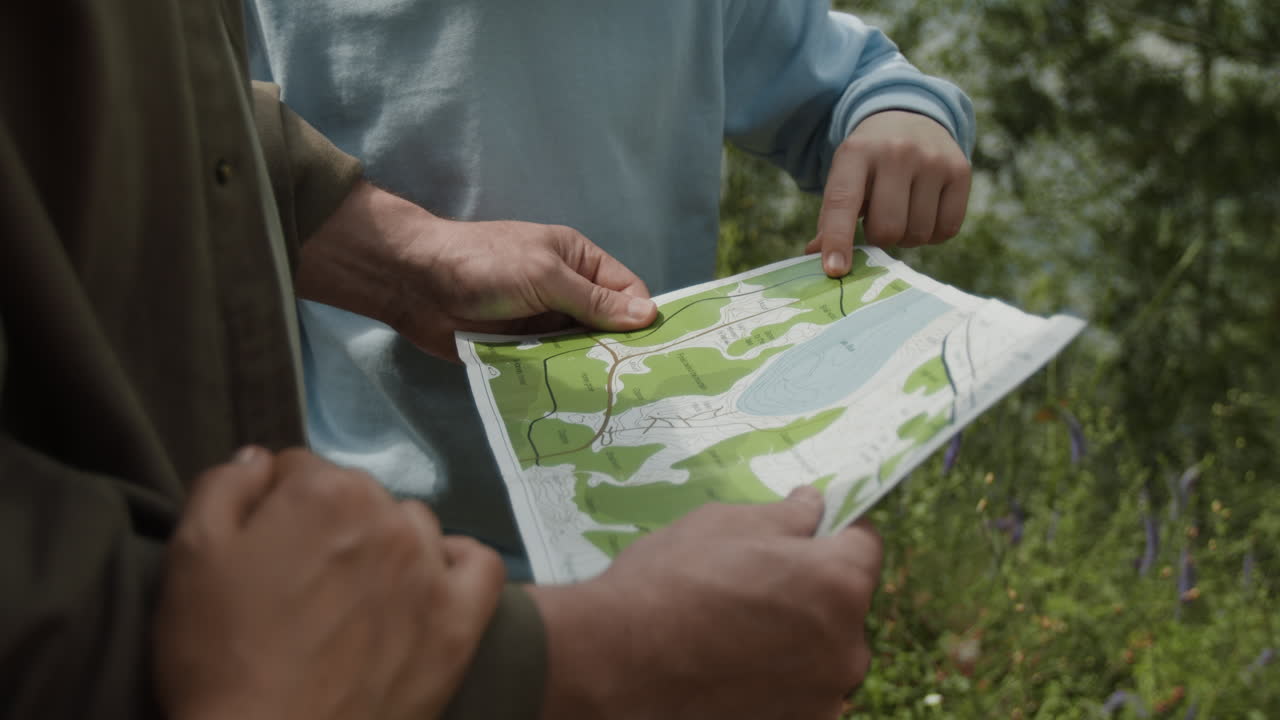 People using a map outdoors