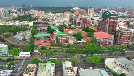 aerial view of colorful kaoshiung city with wenzao university during sunny day, asia