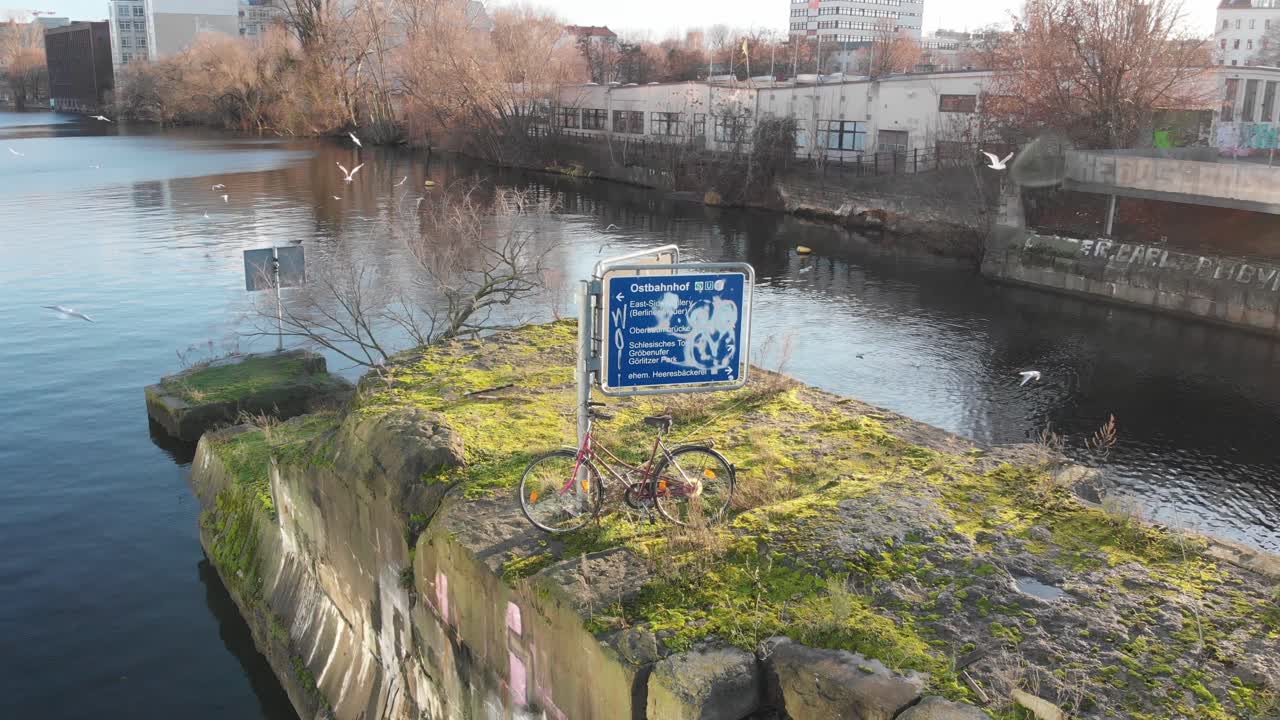 Berlin Spree Tiny Island with a bike this is a classic Berlin view recorded with a drone at 4k 24fps