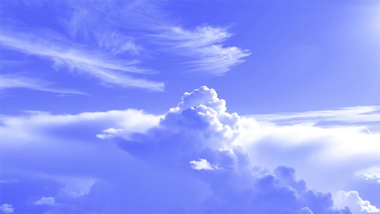 Beautiful blue sky with fluffy white cumulus and cirrus clouds