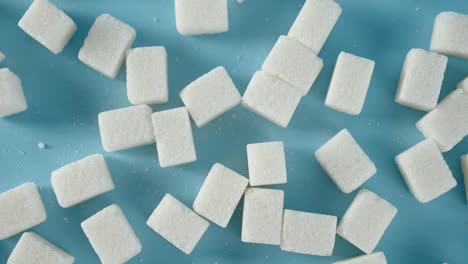 on the table slowly rotate sugar in cubes.