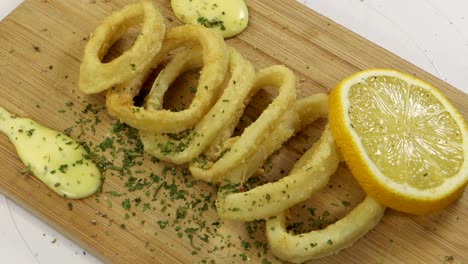 Adding-pepper-to-fried-squid-rings