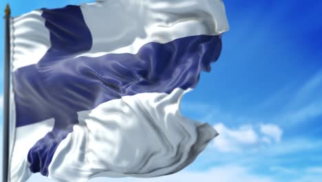 la bandera finlandesa está ondeando lentamente contra el cielo azul.