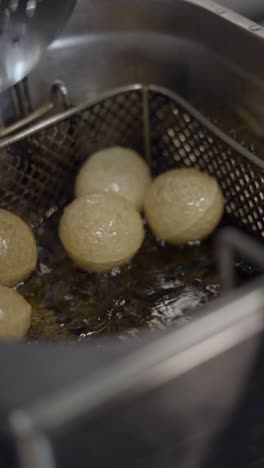 deep frying dough balls in hot oil