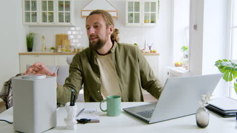 Man-sitting-in-the-living-room