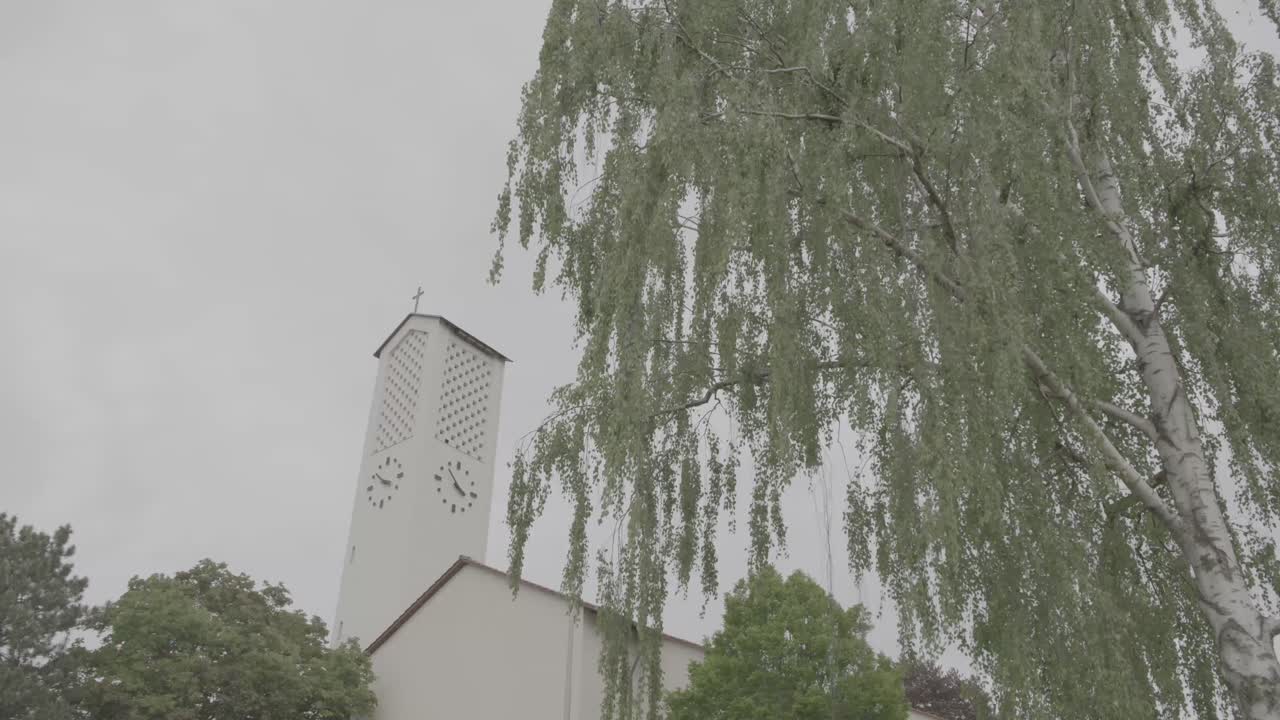 Exterior view of the Bruder Klaus church in Gundelfingen, Germany on a cloudy day
