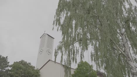 exterior view of the bruder klaus church in gundelfingen, germany on a cloudy day