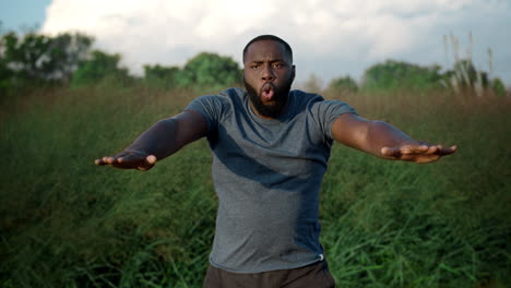 Athletic-man-doing-squats-in-park