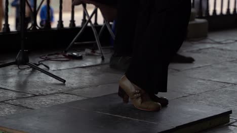 feet of flamenco dancer stomping in slow motion