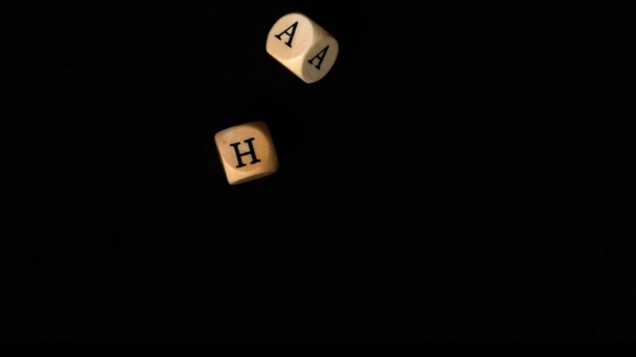 Purple particle stream sweeping across frame striking wooden letter cubes, aligning them into WHAT