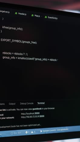 vertical video young it engineer typing code on computer and running script