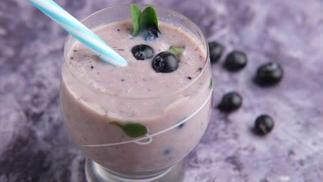 purple blueberry smoothie in a glass