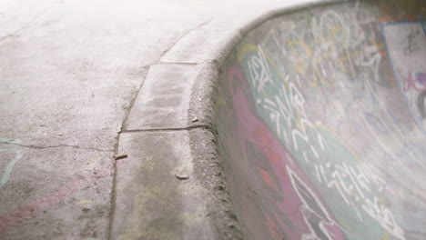 boy's feet on skateboard in the park.