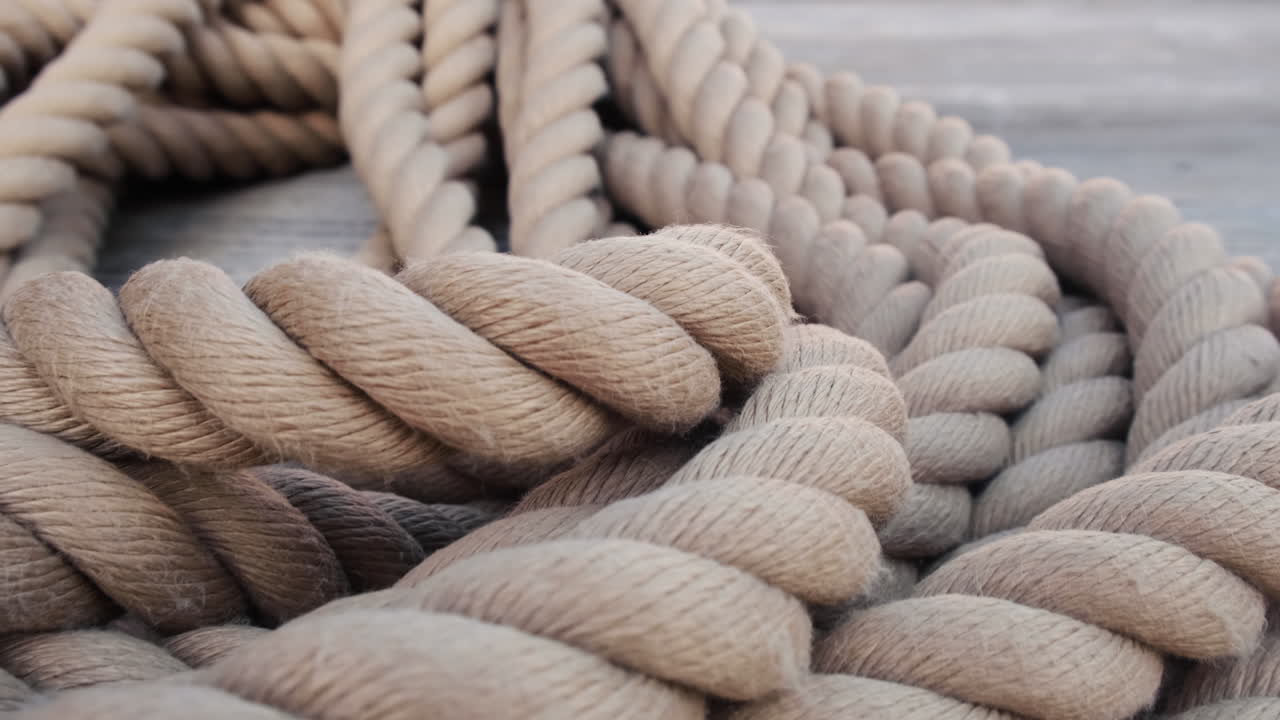 A rope covered rolled in coil in daytime in the port