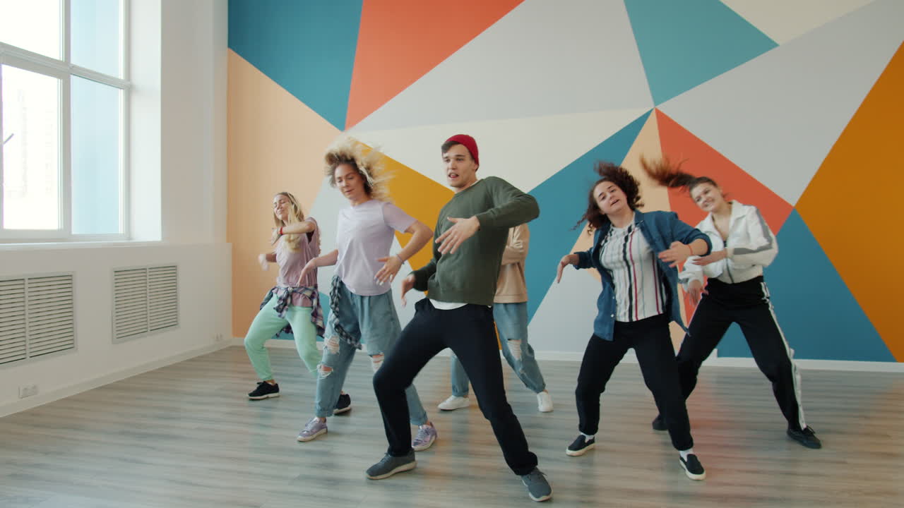 Group of young people dancing in a dance studio