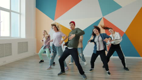 group of young people dancing in a dance studio