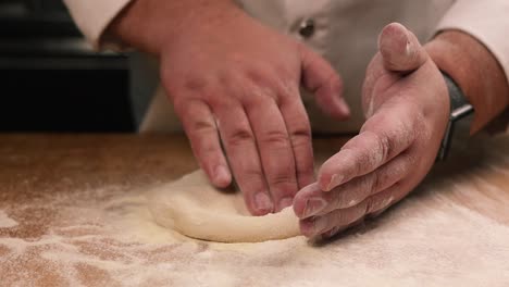 chef kneading dough