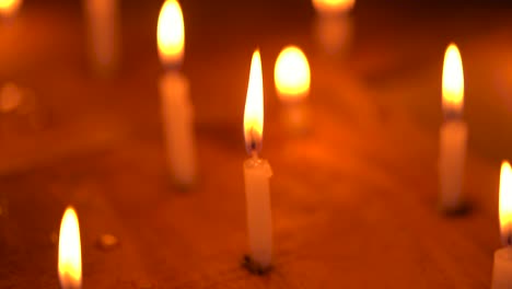 burning lit candles at church