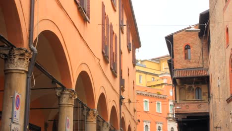 low angle shot of beautiful porticoes in historic center in bologna, northern italy at daytime