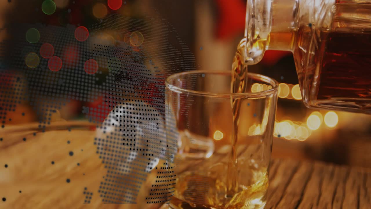 Decanter tilting pouring, tumbler filling with amber liquid swirling settling showing dotted globe