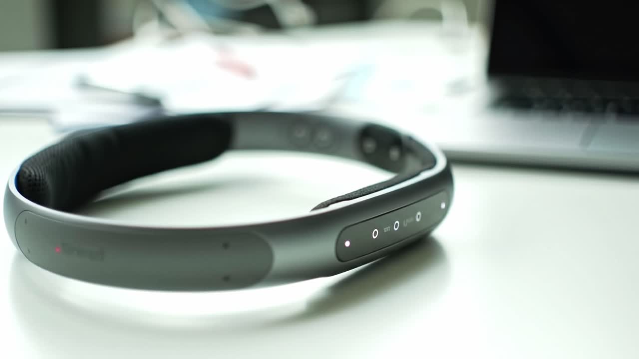 Gray Wearable Device on a Desk