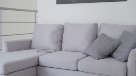 gray armchair with two cushions in living room