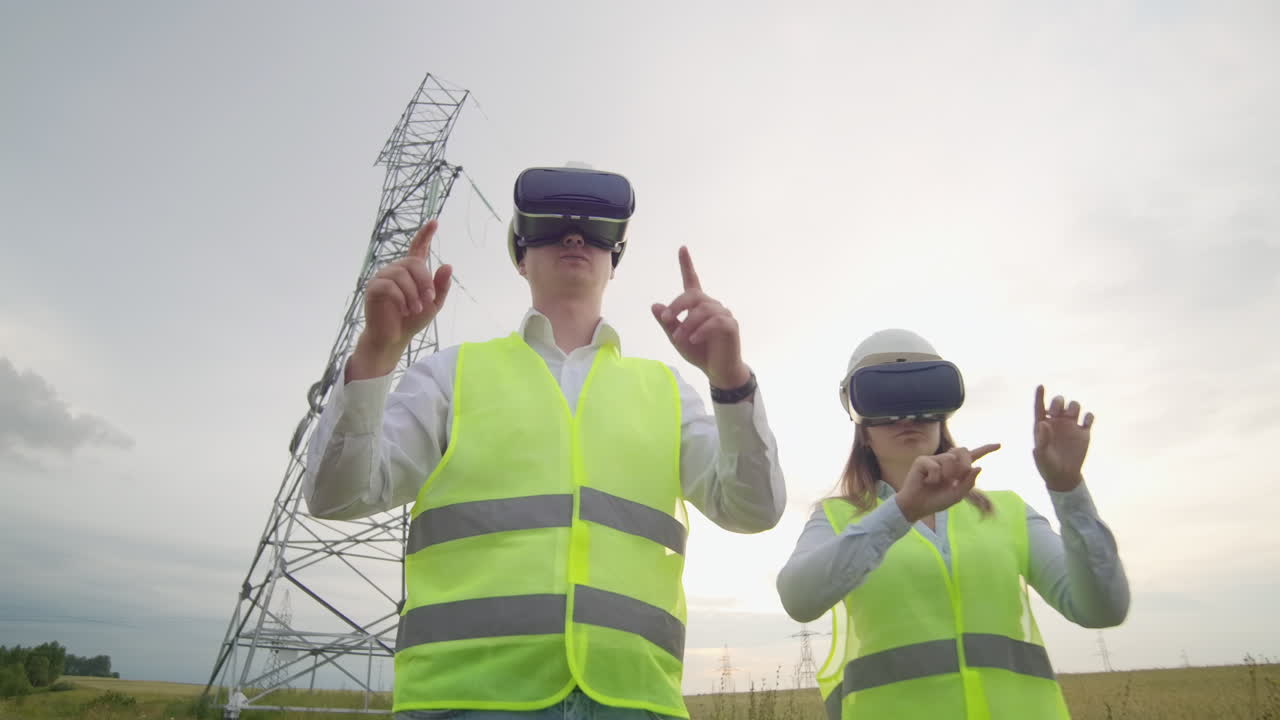 Energy engineers use virtual reality glasses to control the solar panel system and deliver energy to consumers. Engineers of the future.