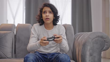 indian kid boy playing video games