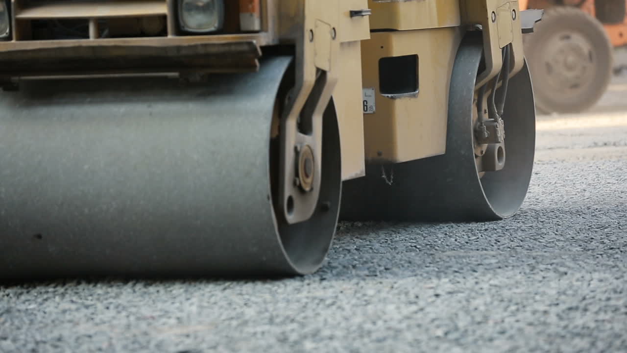 Road Roller On The Road Construction. Road roller on the road construction laying gravel