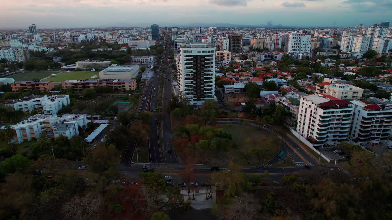 Aerial over Helios del Oeste District in Santo Domingo City at Sunset