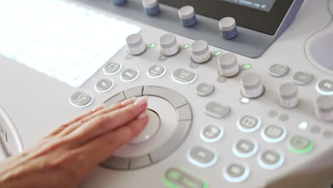 ultrasound technician operating machine
