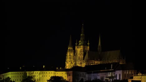 prague castle fortress in night surrounded by different buildings lit by different colours official office of the president of the czech republic baroque mannerism architecture style zooming in cinema