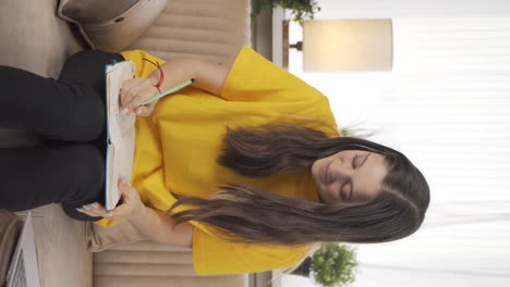 Vertical-video-of-Female-student-waving-to-the-camera.