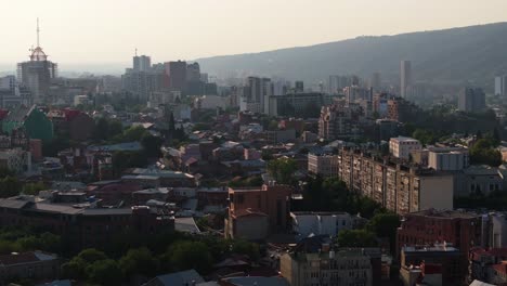 aerial view of skyscrapers in tbilisi, georgia during summer sunrise