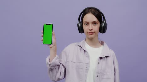 teenage girl with headphones and smartphone