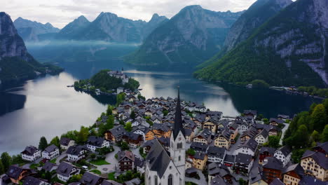 aerial view of a picturesque alpine village by a lake