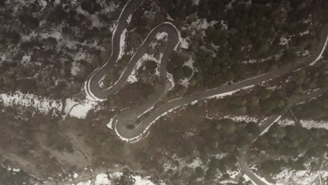 serpentine mountain road in winter